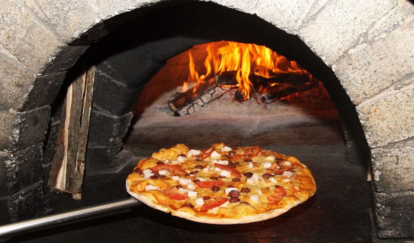 Roaring woodfired pizza oven and fresh pizza